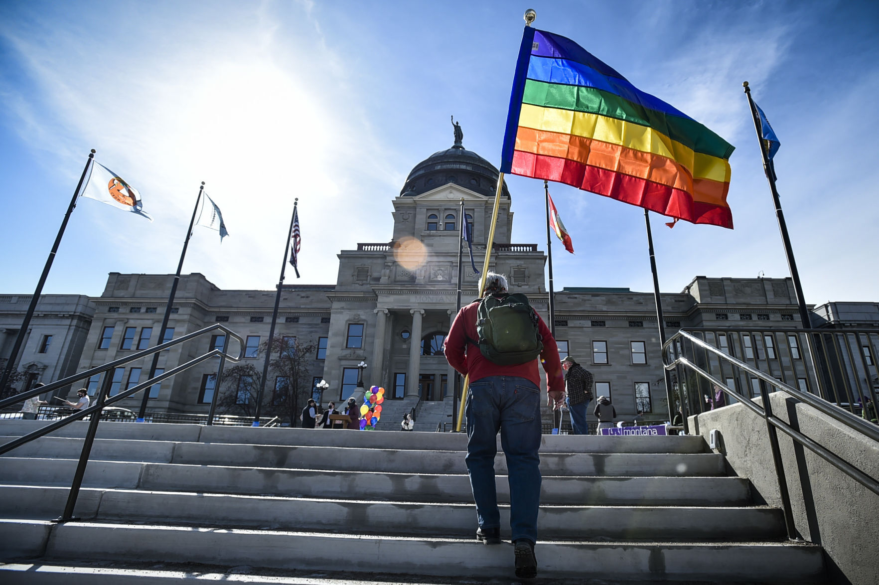 Demonstrators gather on the step of the Montana State Capitol